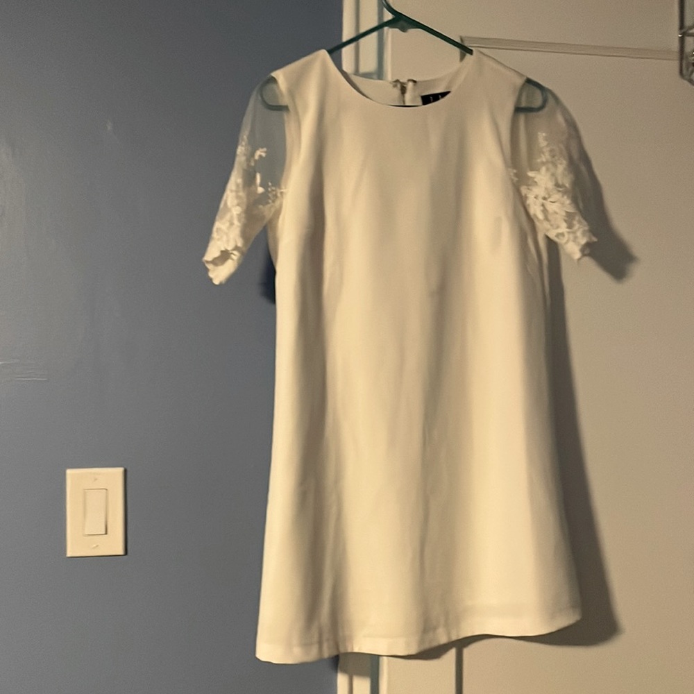 Lulus White dress with lace sleeve detail. Small stain pictured.